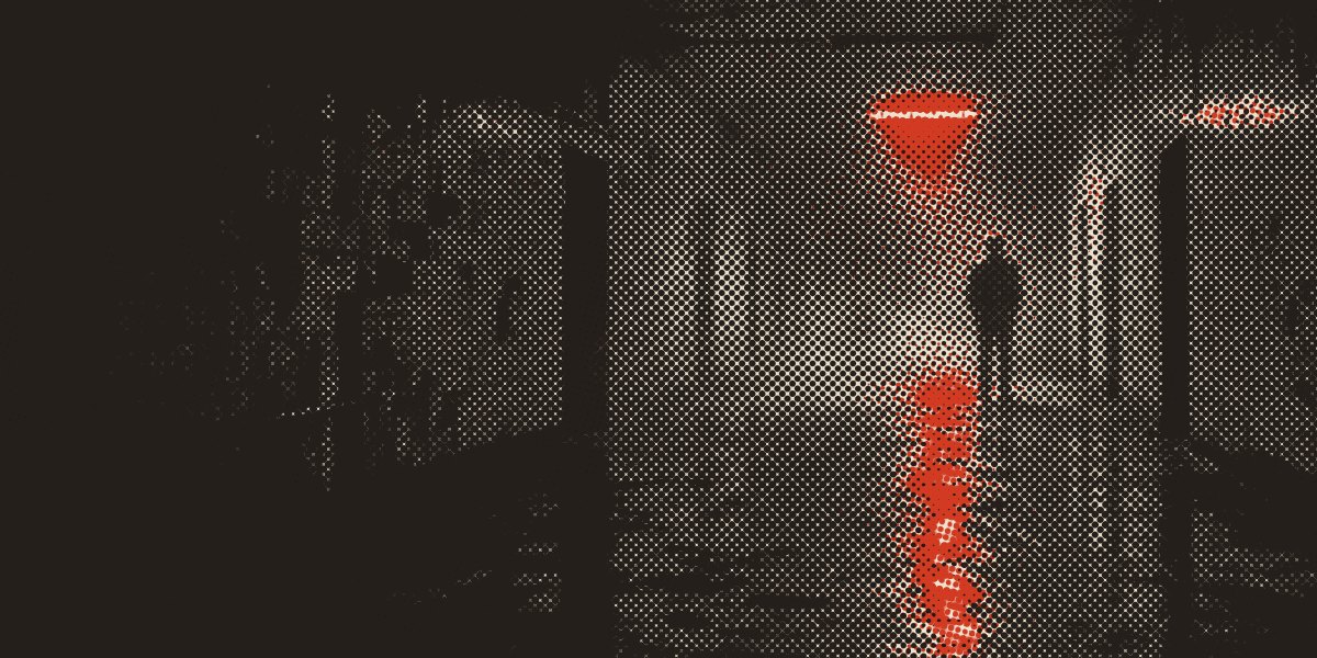 A long corridor with one light at the far end